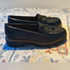 Clark’s black loafers